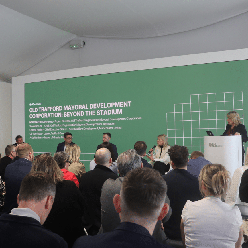 A panel session about the Old Trafford MDC on the stage at the Manchester Stand at MIPIM 2026
